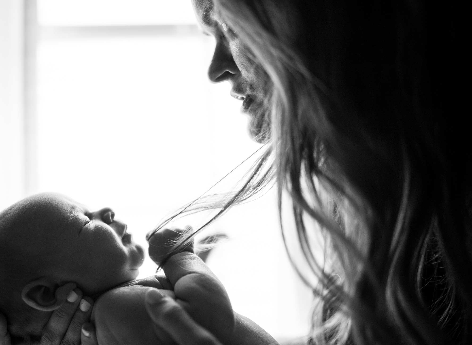 Baby Holding Hair